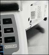 A Hobart scale dispensing a printed label