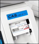 A CAS scale dispensing a printed label