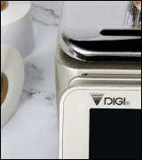 A DIGI scale dispensing a printed label