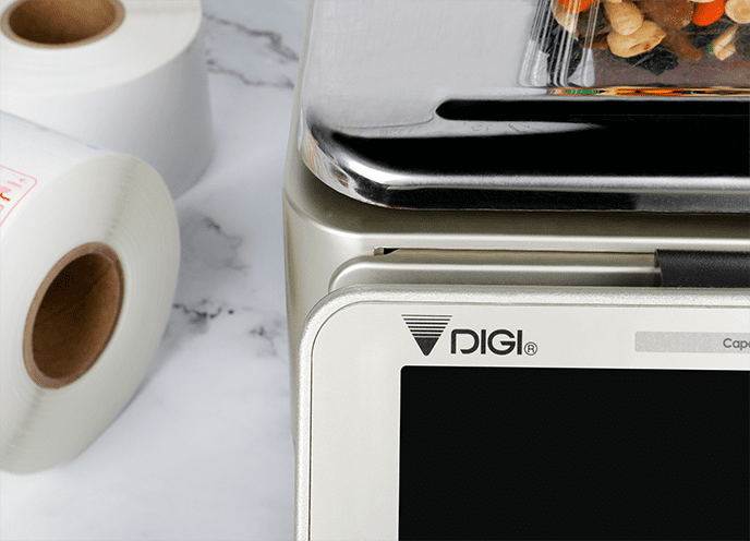 A DIGI scale dispensing a printed label