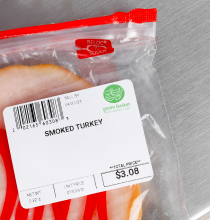 A bag of deli turkey with a scale label affixed to it