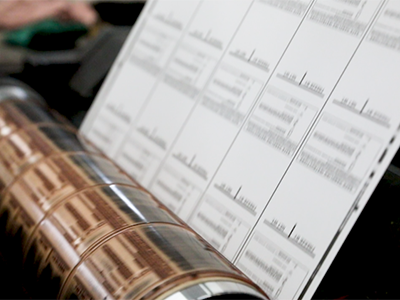 Bulk preprinted scale labels being printed