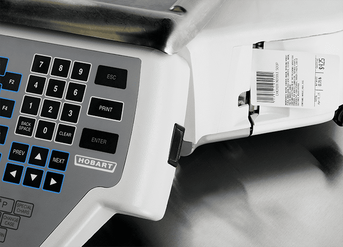 A Hobart scale dispensing a printed label