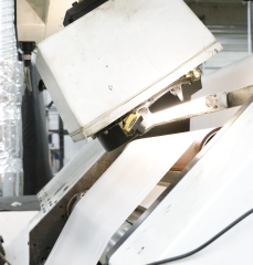 Label material moving through a machine