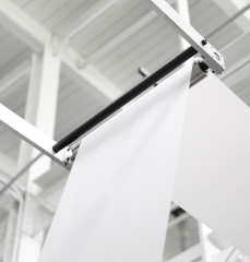 Bulk label material flowing through a machine