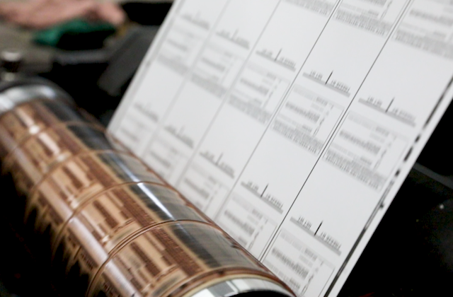 Bulk preprinted scale labels being printed